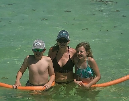 Woman and two children in the water during an Islamorada boat tour.